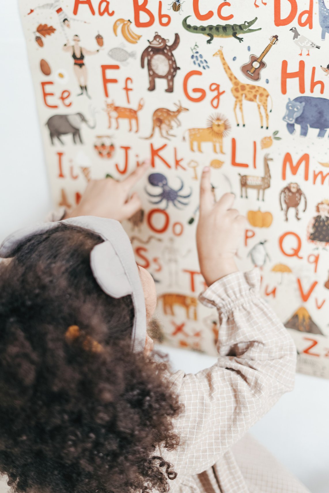 Child Reading English Alphabet